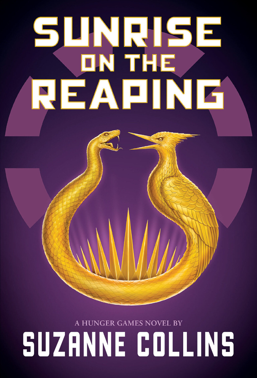 Pictured is the cover of Sunrise on the Reaping: A Hunger Games Novel by Suzanne Collins. The cover art is purple, and it shows the image of a flint-striker pendant depicting a snake facing a mockingjay.